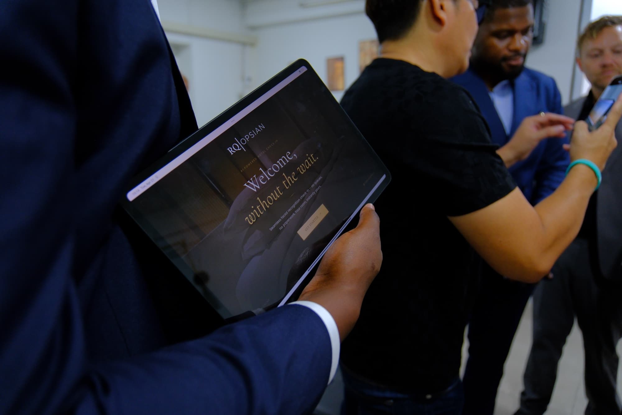RQ | Opsian check-in demo on a tablet — 'Welcome, without the wait'